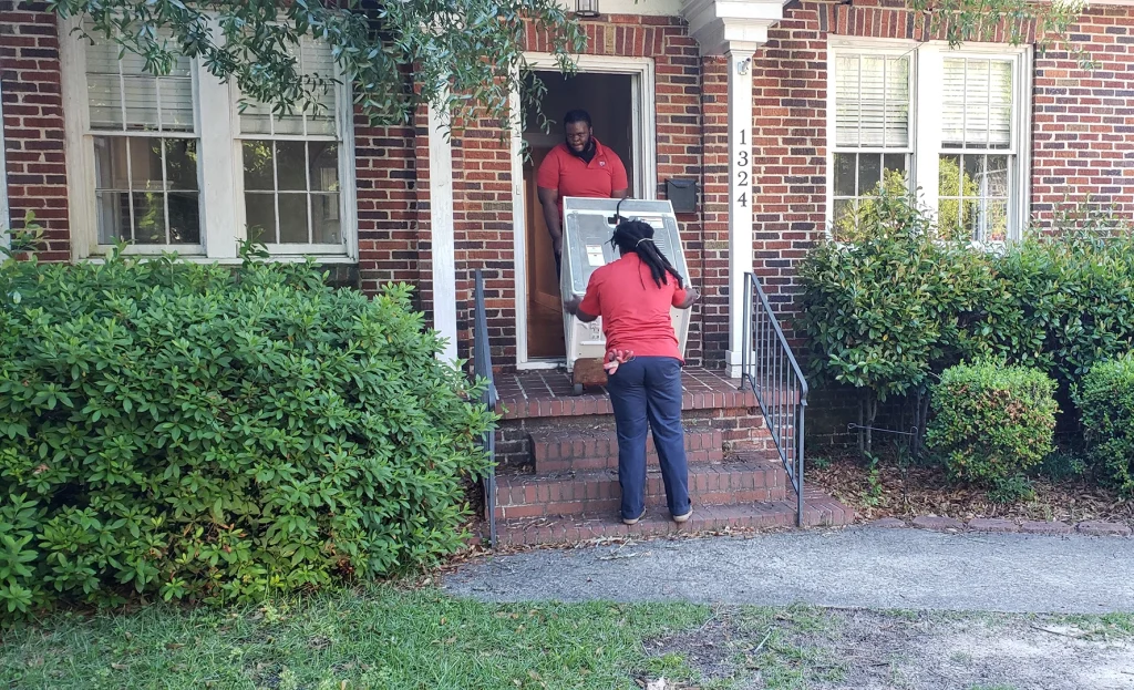 appliance being removed from a house